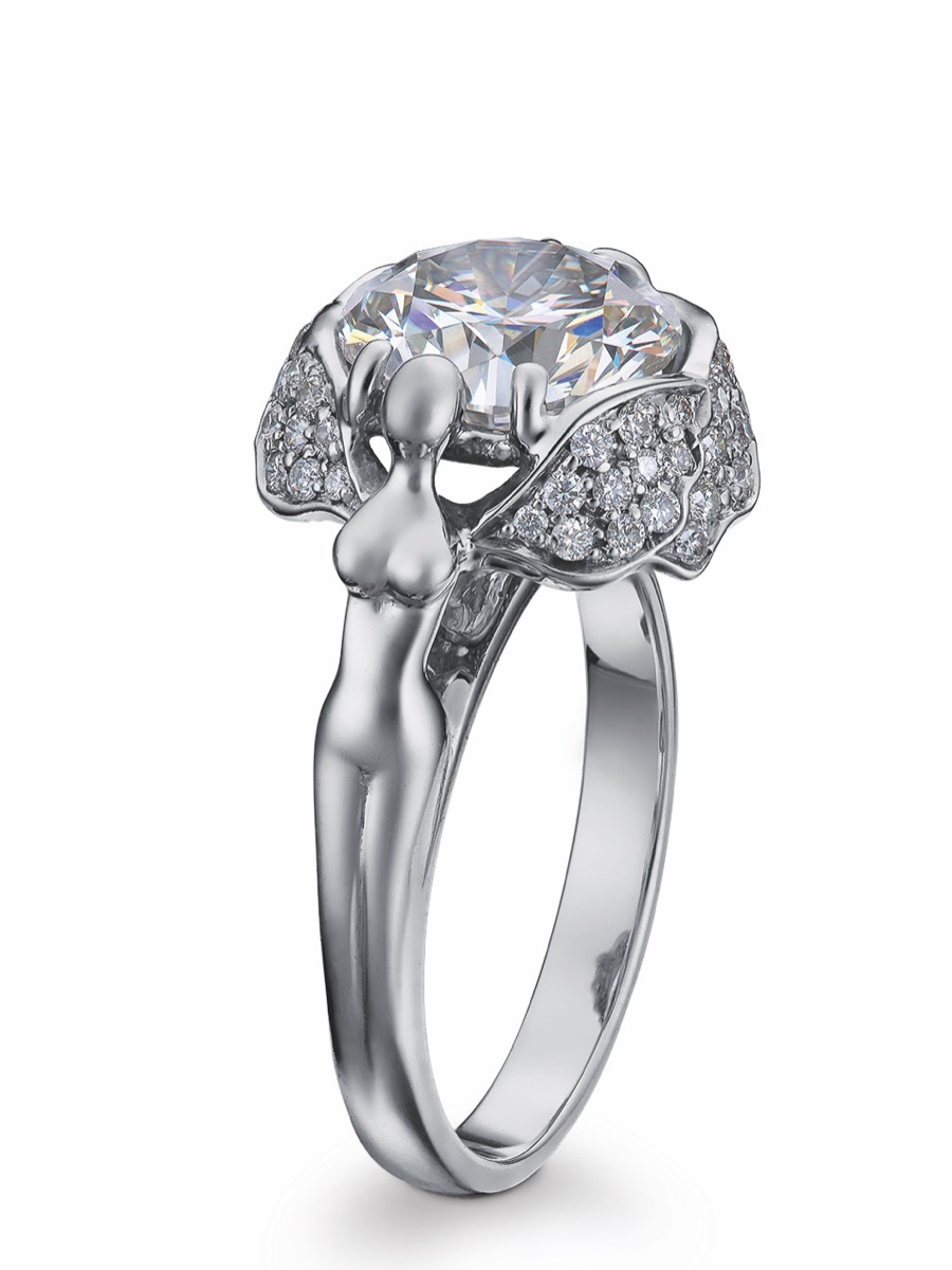 The Angel Ring: an angel figure with outstretched wings beneath a large solitaire
