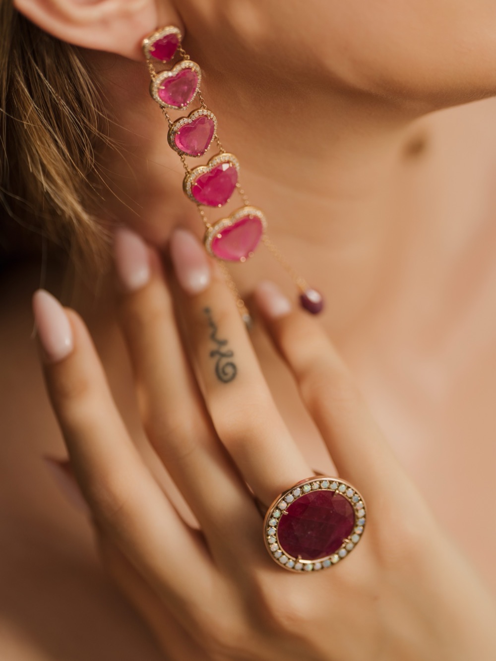 Rings and a bracelet in colour, worn